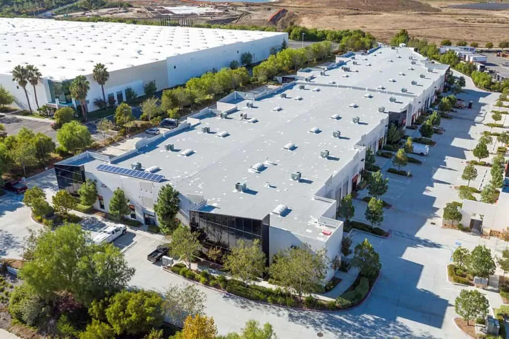 Commercial building with a white flat TPO roof