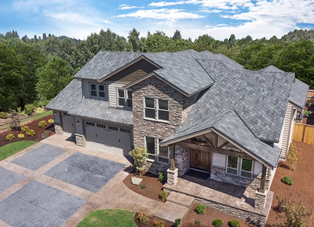 Two-story home with a new gray architectural shingle roof